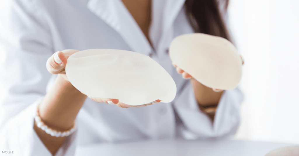 A woman deciding between smooth and textured implants for her breast augmentation.