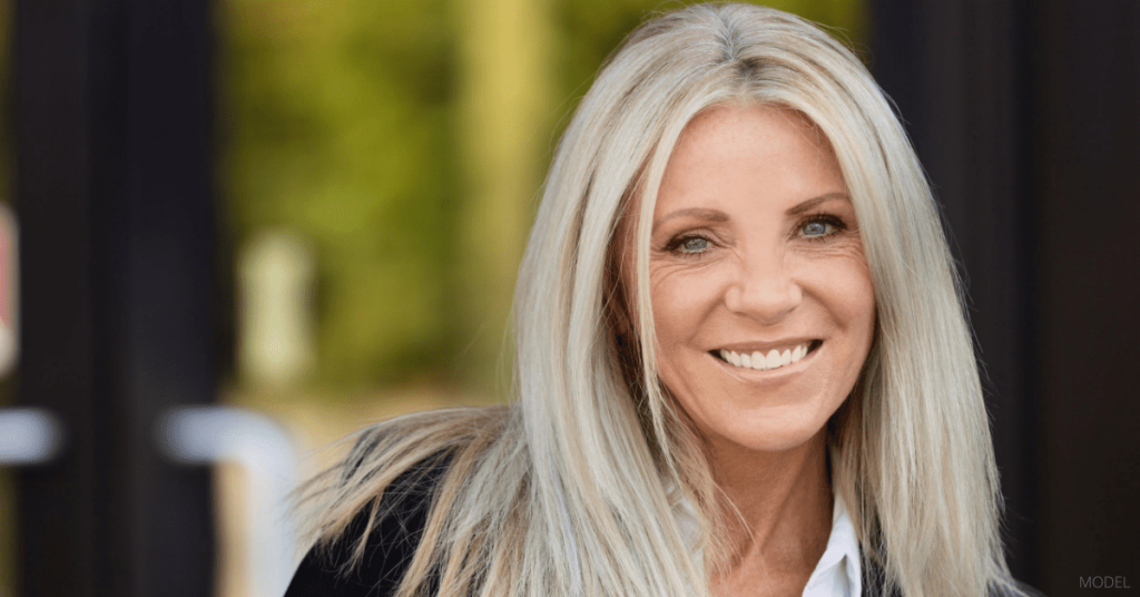 A woman pleased with her eyelid surgery.