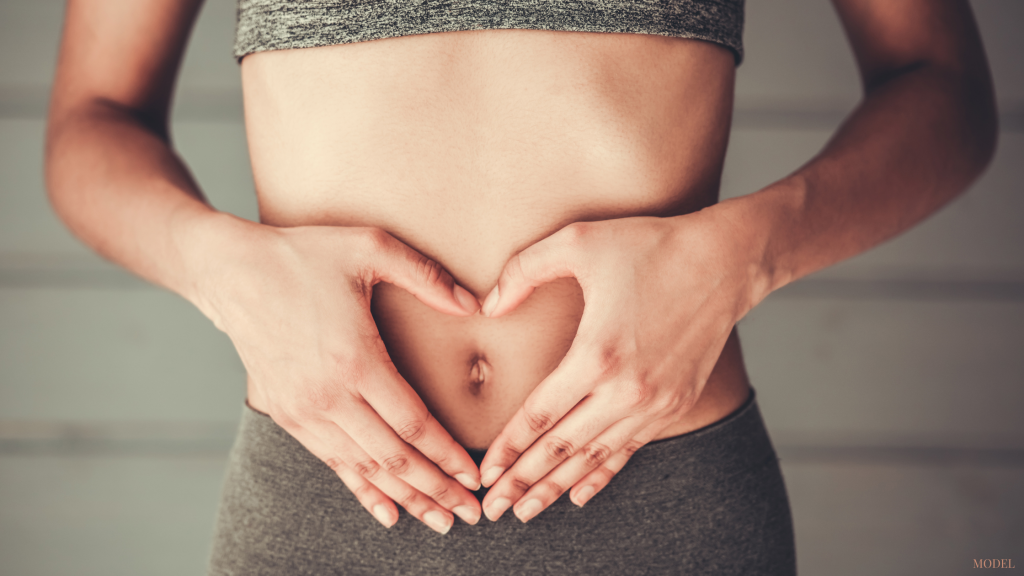 Woman experiencing benefits of tummy tuck surgery in Worthington, OH